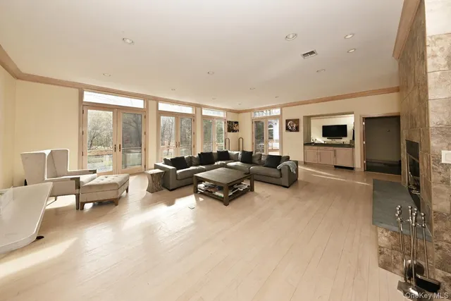 a living room with furniture and large windows