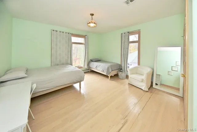 a bedroom with a bed and a couch