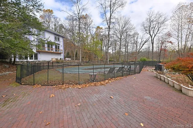 a view of a yard with wooden deck