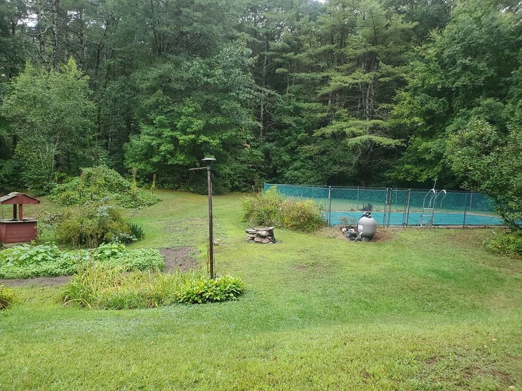 808 Patriots Road Templeton, MA 01468 - Photo 21 of 22 a view of a backyard with a garden and entertaining space