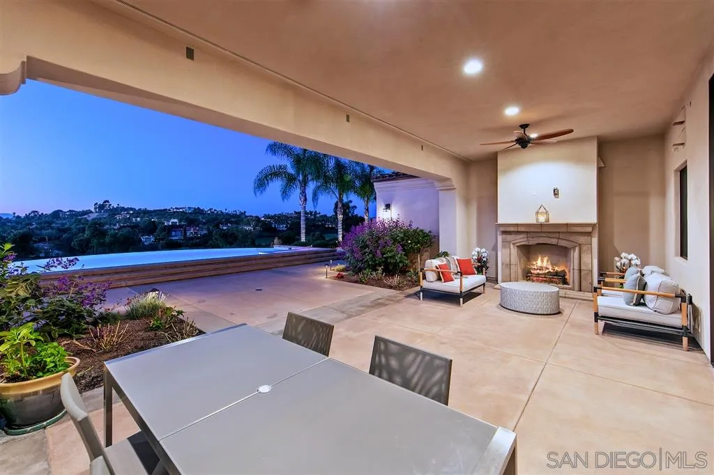 6806 St Andrews Road Rancho Santa Fe, CA 92067 - Photo 12 of 25 a view of a patio with furniture and a fire pit