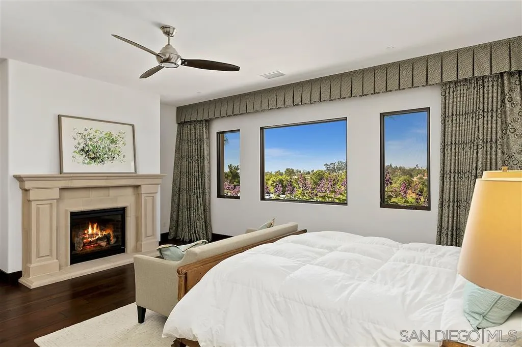 6806 St Andrews Road Rancho Santa Fe, CA 92067 - Photo 16 of 25 a bedroom with a bed and a fireplace