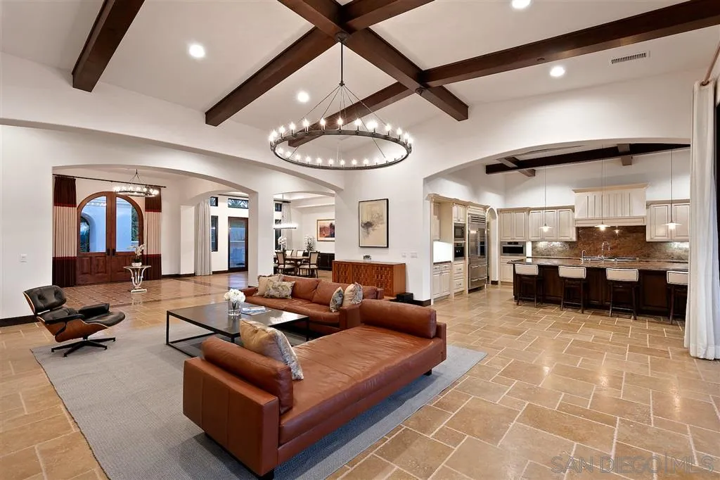 6806 St Andrews Road Rancho Santa Fe, CA 92067 - Photo 3 of 25 a living room with furniture and a chandelier