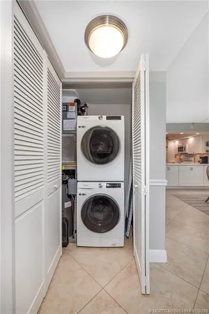 a view of a hallway with washer and dryer