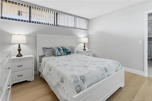 a large white bed in a white room
