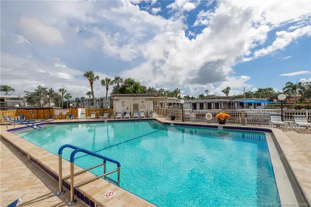 a view of a swimming pool with a patio