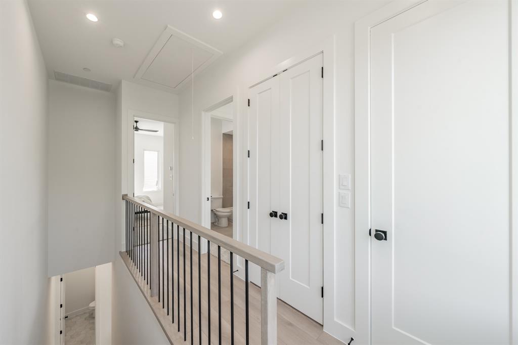 5320 Reiger Avenue, Unit 103 Dallas, TX 75214 - Photo 11 of 29 a view of a hallway with white doors