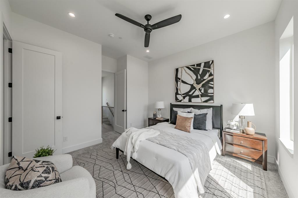 5320 Reiger Avenue, Unit 103 Dallas, TX 75214 - Photo 14 of 29 a bedroom with a bed and a chandelier