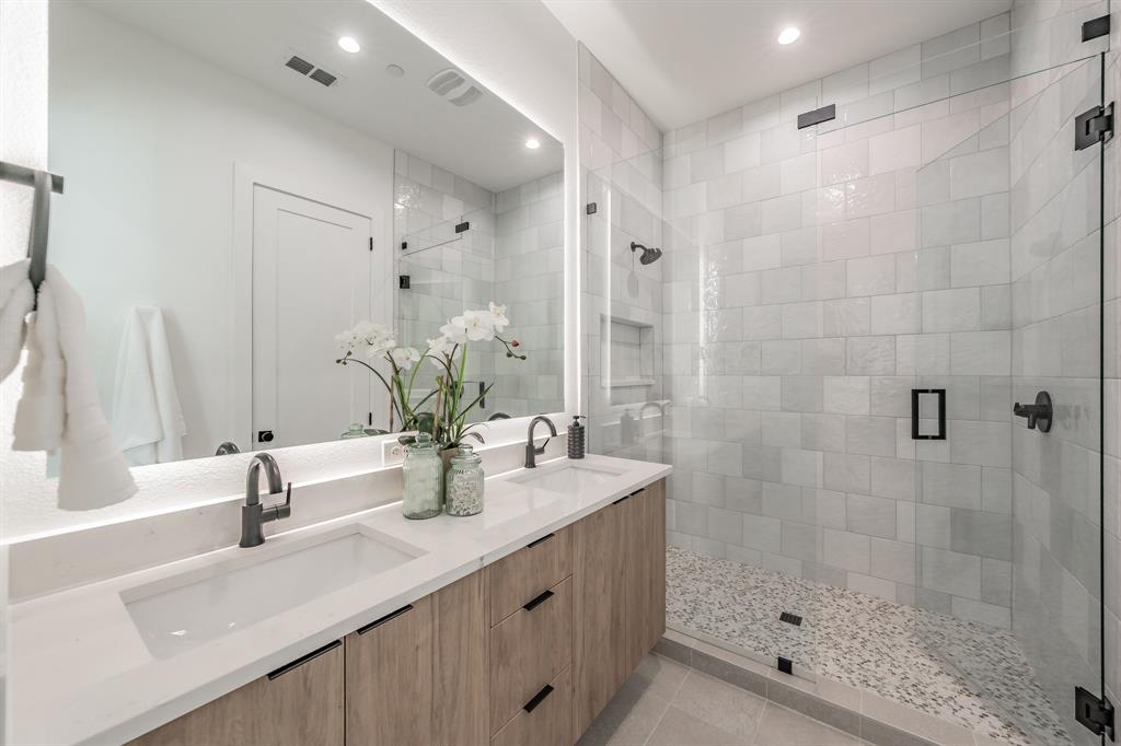 5320 Reiger Avenue, Unit 103 Dallas, TX 75214 - Photo 19 of 29 a bathroom with a sink and a mirror