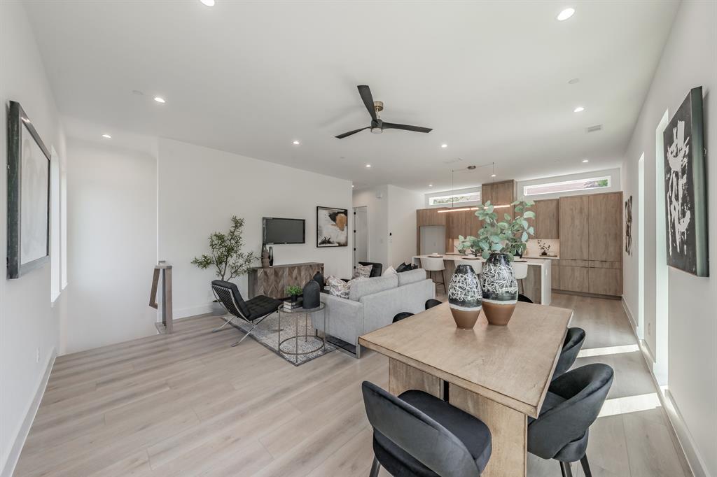 5320 Reiger Avenue, Unit 103 Dallas, TX 75214 - Photo 2 of 29 a living room with furniture kitchen view and a wooden floor