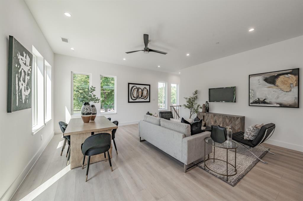 5320 Reiger Avenue, Unit 103 Dallas, TX 75214 - Photo 4 of 29 a living room with furniture and a large window