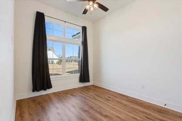 a view of an empty room with a window