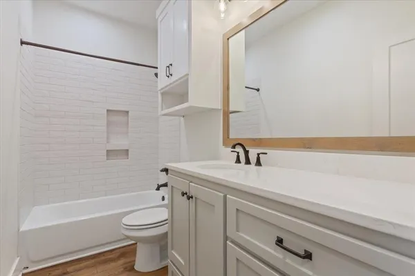 a bathroom with a sink a toilet and a bathtub