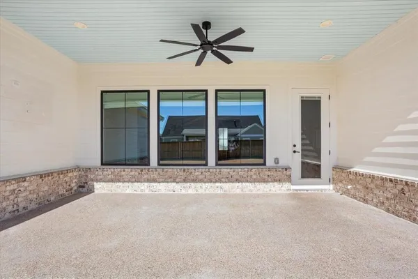 a view of livingroom with a ceiling fan and window
