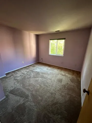 a room with a sink and a mirror