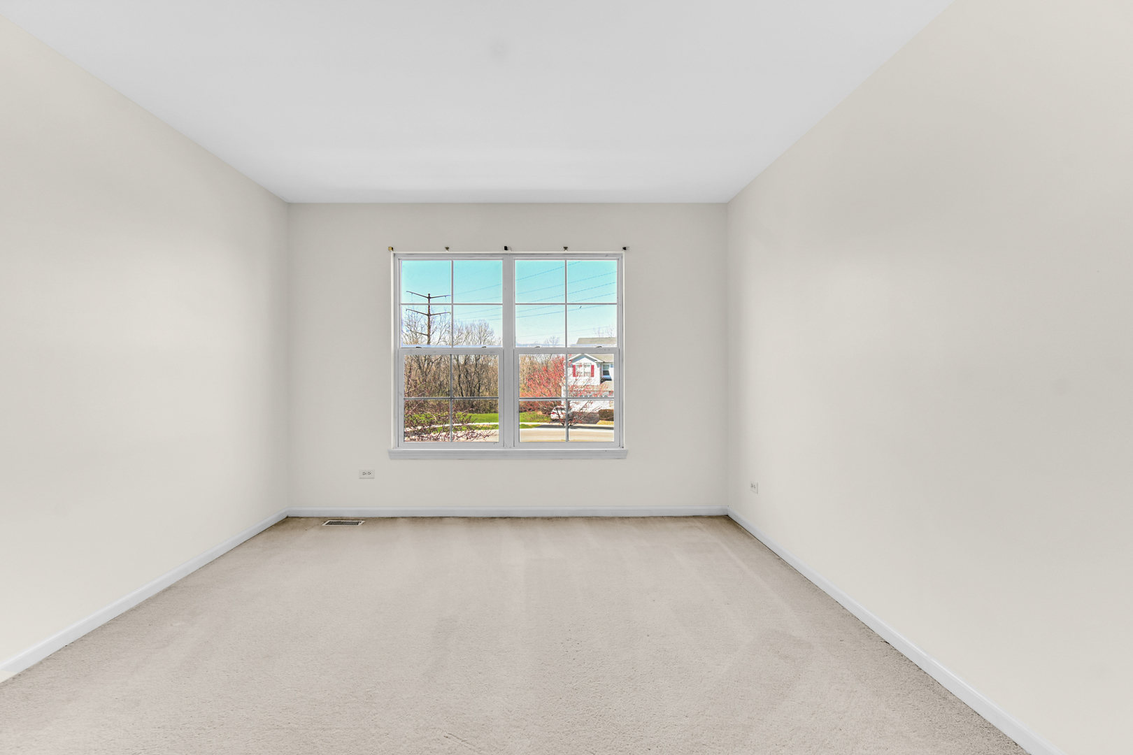 16743 Winding Creek Road Plainfield, IL 60586 - Photo 12 of 25 an empty room with window