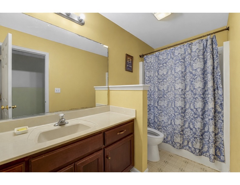 16743 Winding Creek Road Plainfield, IL 60586 - Photo 15 of 25 a bathroom with a sink and a mirror
