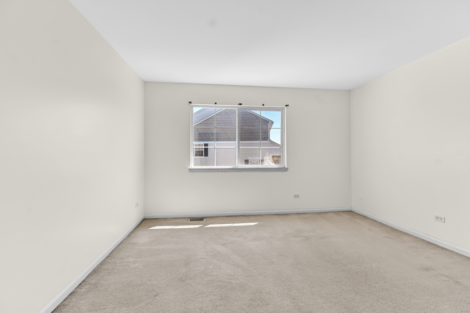 16743 Winding Creek Road Plainfield, IL 60586 - Photo 17 of 25 an empty room with windows