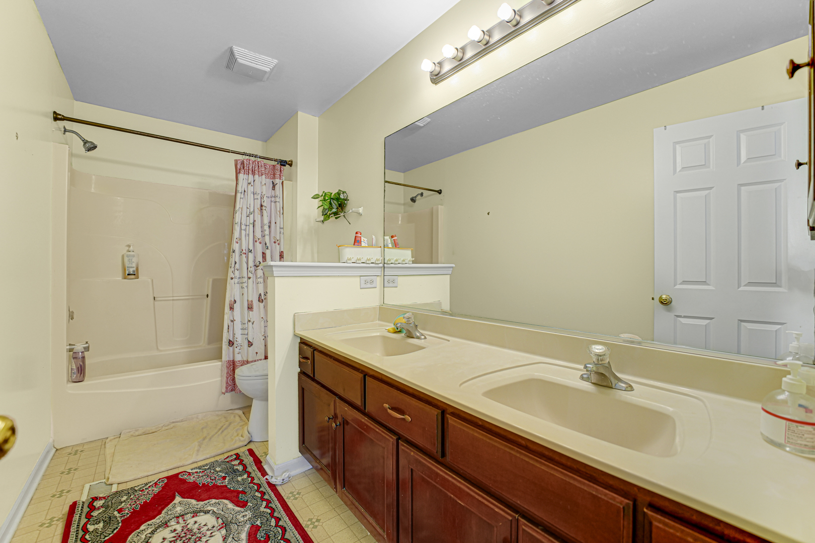 16743 Winding Creek Road Plainfield, IL 60586 - Photo 21 of 25 a bathroom with a sink a toilet and shower