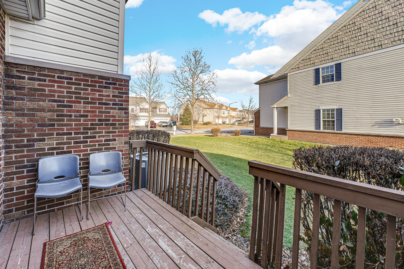 16743 Winding Creek Road Plainfield, IL 60586 - Photo 23 of 25 a view of a balcony with wooden floor