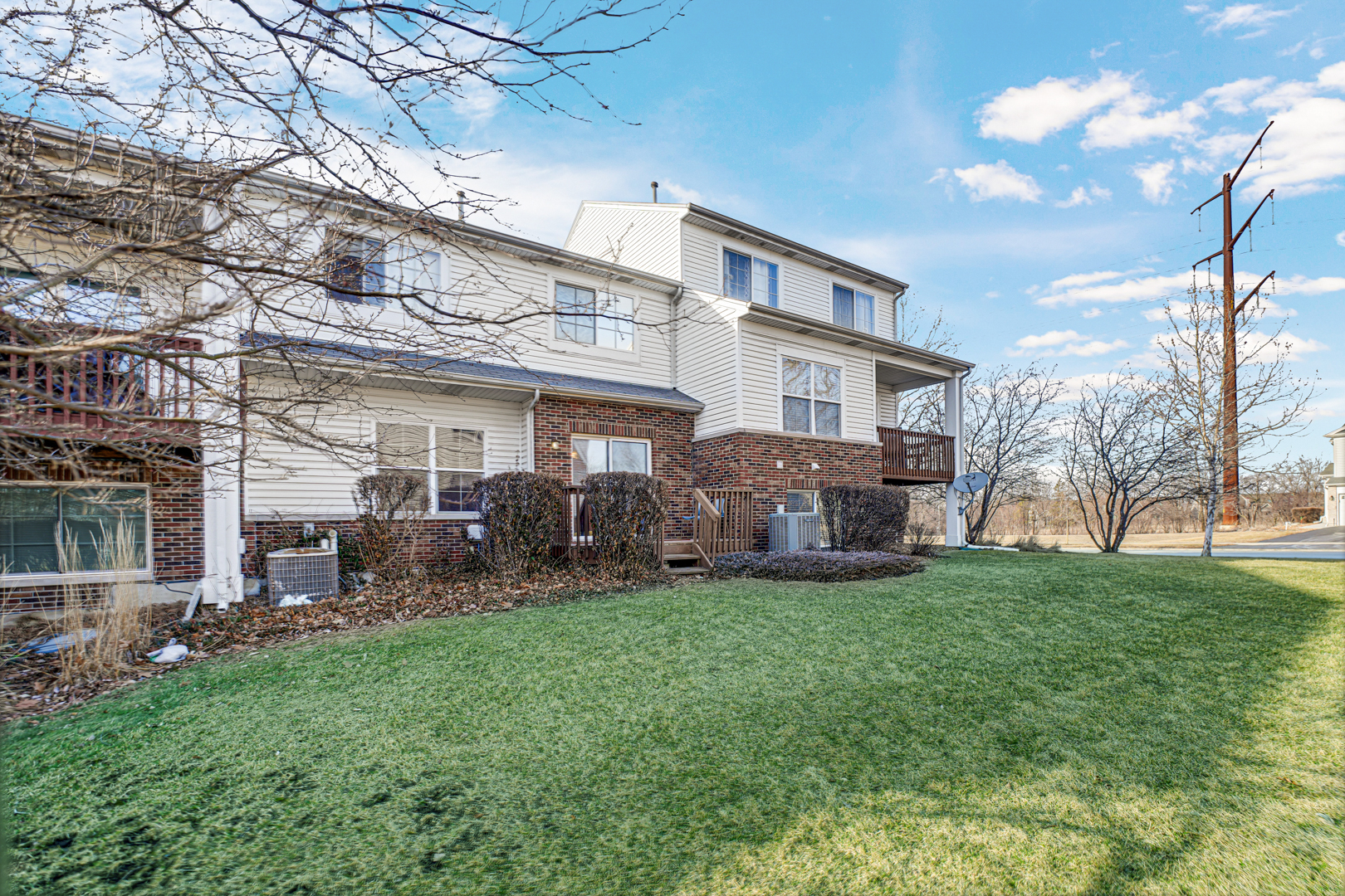16743 Winding Creek Road Plainfield, IL 60586 - Photo 24 of 25 a view of a house with a yard and sitting area