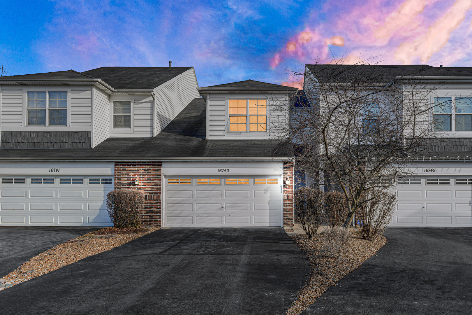 16743 Winding Creek Road Plainfield, IL 60586 - Photo 3 of 25 a front view of a house with a yard