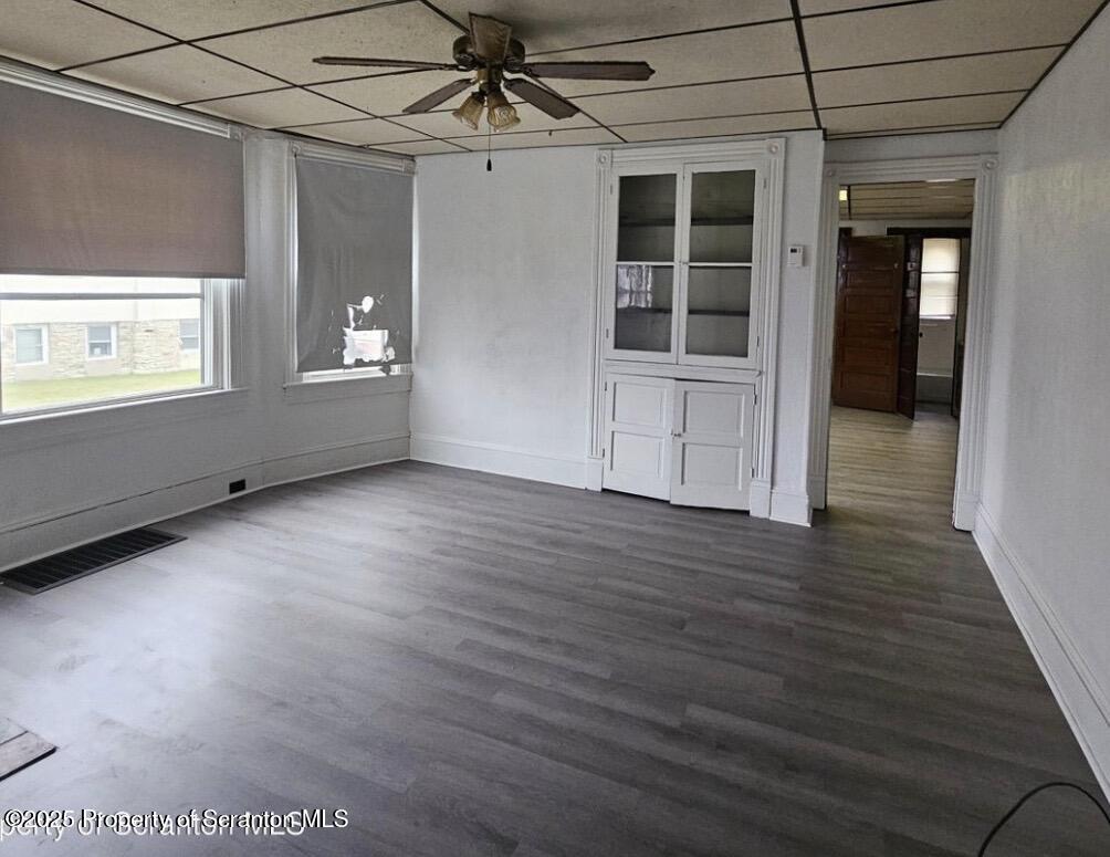 1531 Washburn Street, Unit 1 Scranton, PA 18504 - Photo 3 of 6 a view of empty room with wooden floor and fan