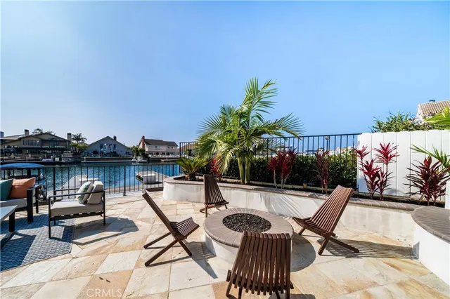 a kitchen with a table and chairs in front of it