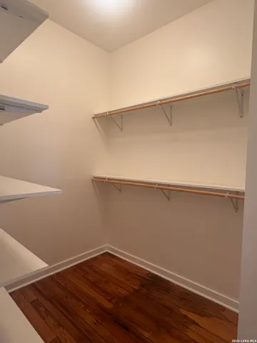 a view of an empty walk in closet