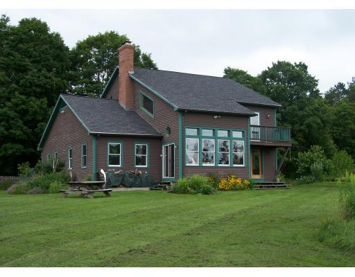 274 Ed Clark Road Colrain, MA 01340 - Photo 1 of 1 a front view of house with a garden and yard
