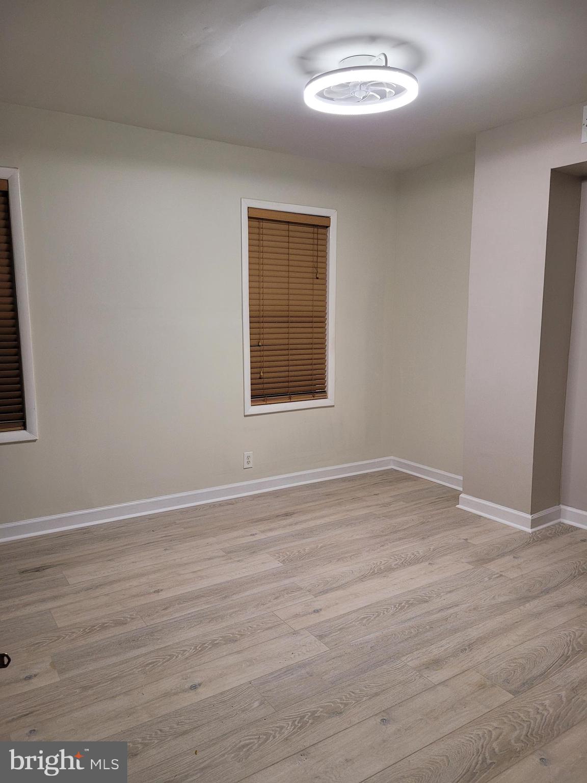 2502 Federal Street Philadelphia, PA 19146 - Photo 15 of 31 a view of an empty room with wooden floor and a window