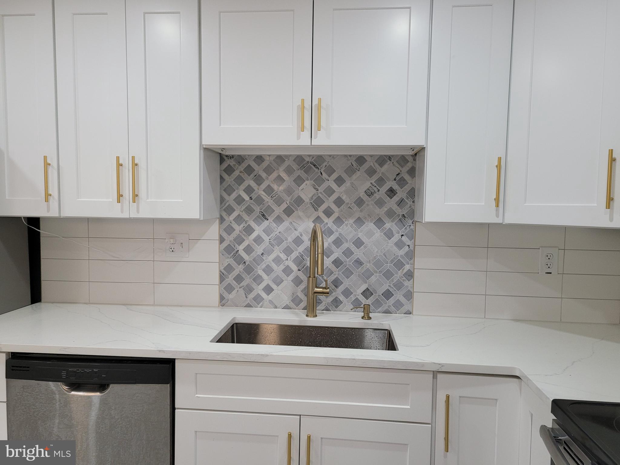 2502 Federal Street Philadelphia, PA 19146 - Photo 6 of 31 a bathroom with a sink and cabinets