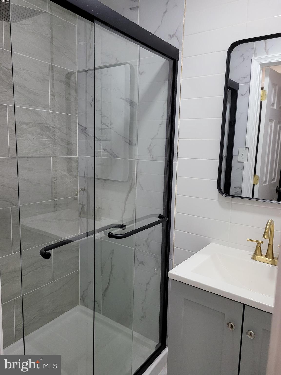 2502 Federal Street Philadelphia, PA 19146 - Photo 7 of 31 a bathroom with a shower and a sink