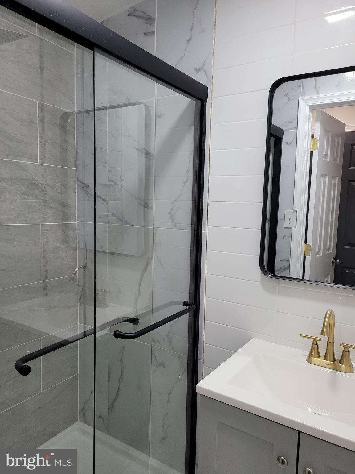 2502 Federal Street Philadelphia, PA 19146 - Photo 8 of 31 a bathroom with a sink and a mirror