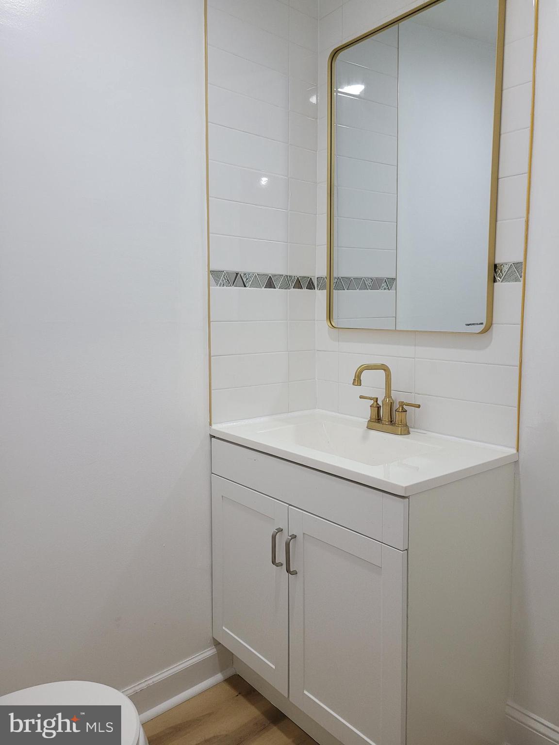 2502 Federal Street Philadelphia, PA 19146 - Photo 9 of 31 a bathroom with a sink and a mirror