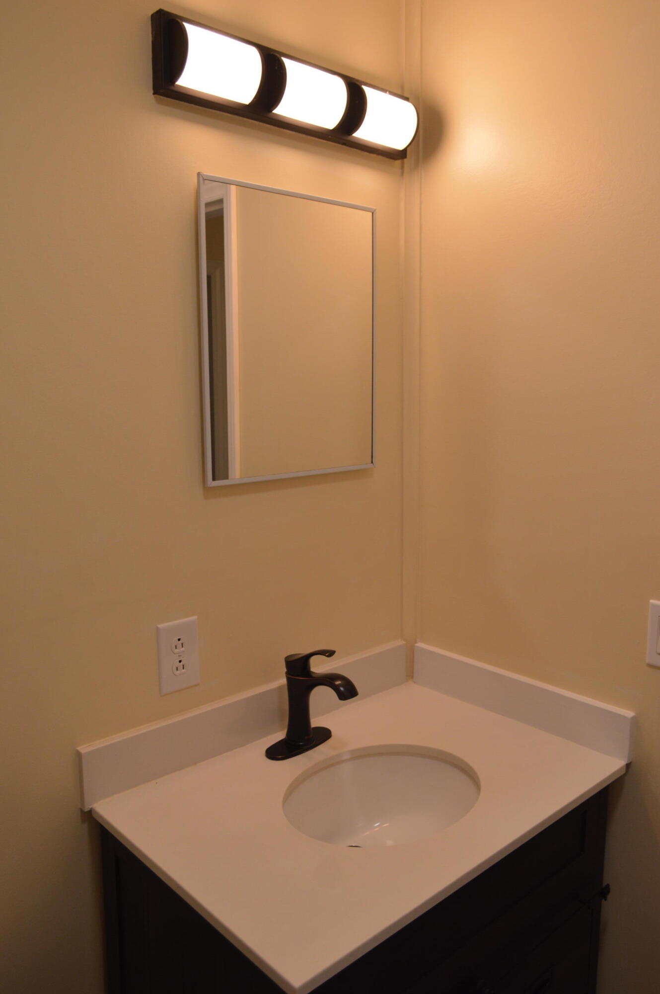 7582 Goat Hill Road See Remarks, AL 36477 - Photo 13 of 43 a bathroom with a sink vanity and a mirror