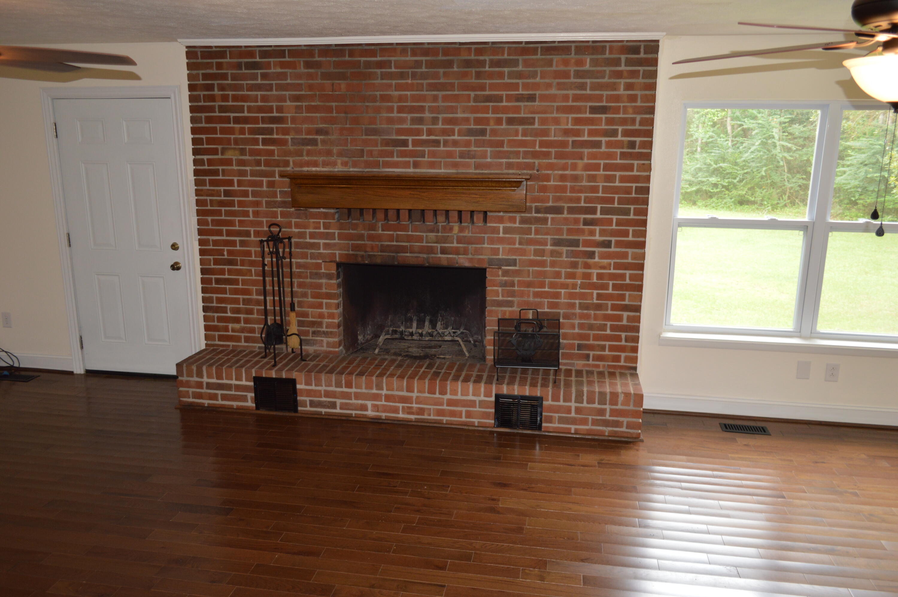 7582 Goat Hill Road See Remarks, AL 36477 - Photo 16 of 43 a living room with a wooden floor