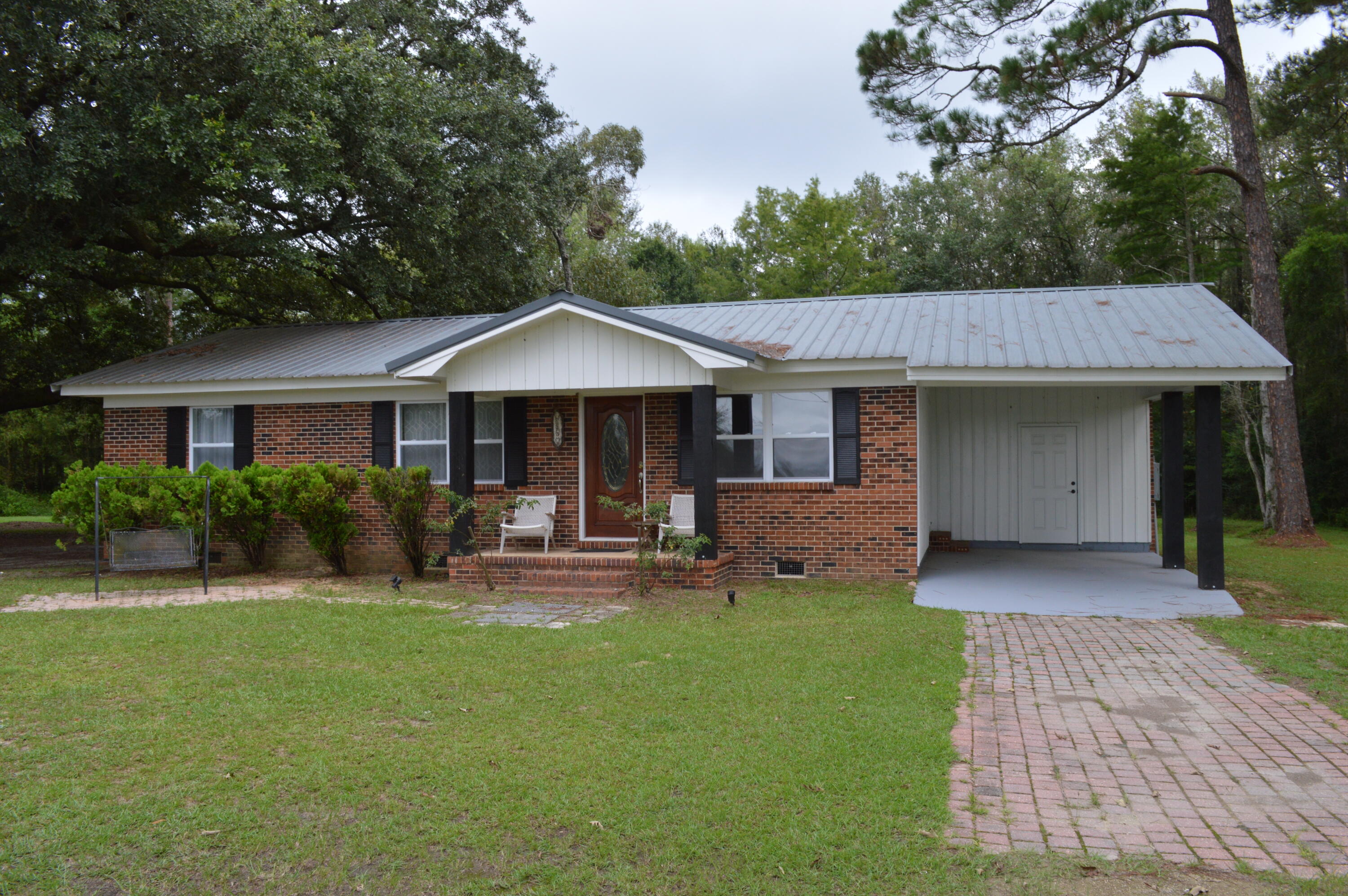 7582 Goat Hill Road See Remarks, AL 36477 - Photo 2 of 43 a front view of a house with garden