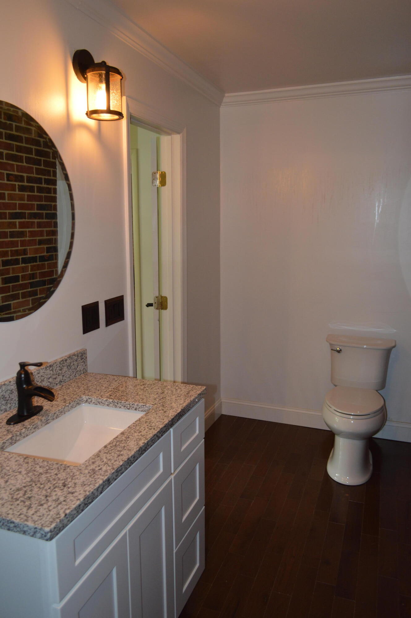 7582 Goat Hill Road See Remarks, AL 36477 - Photo 22 of 43 a bathroom with a granite countertop sink and a toilet