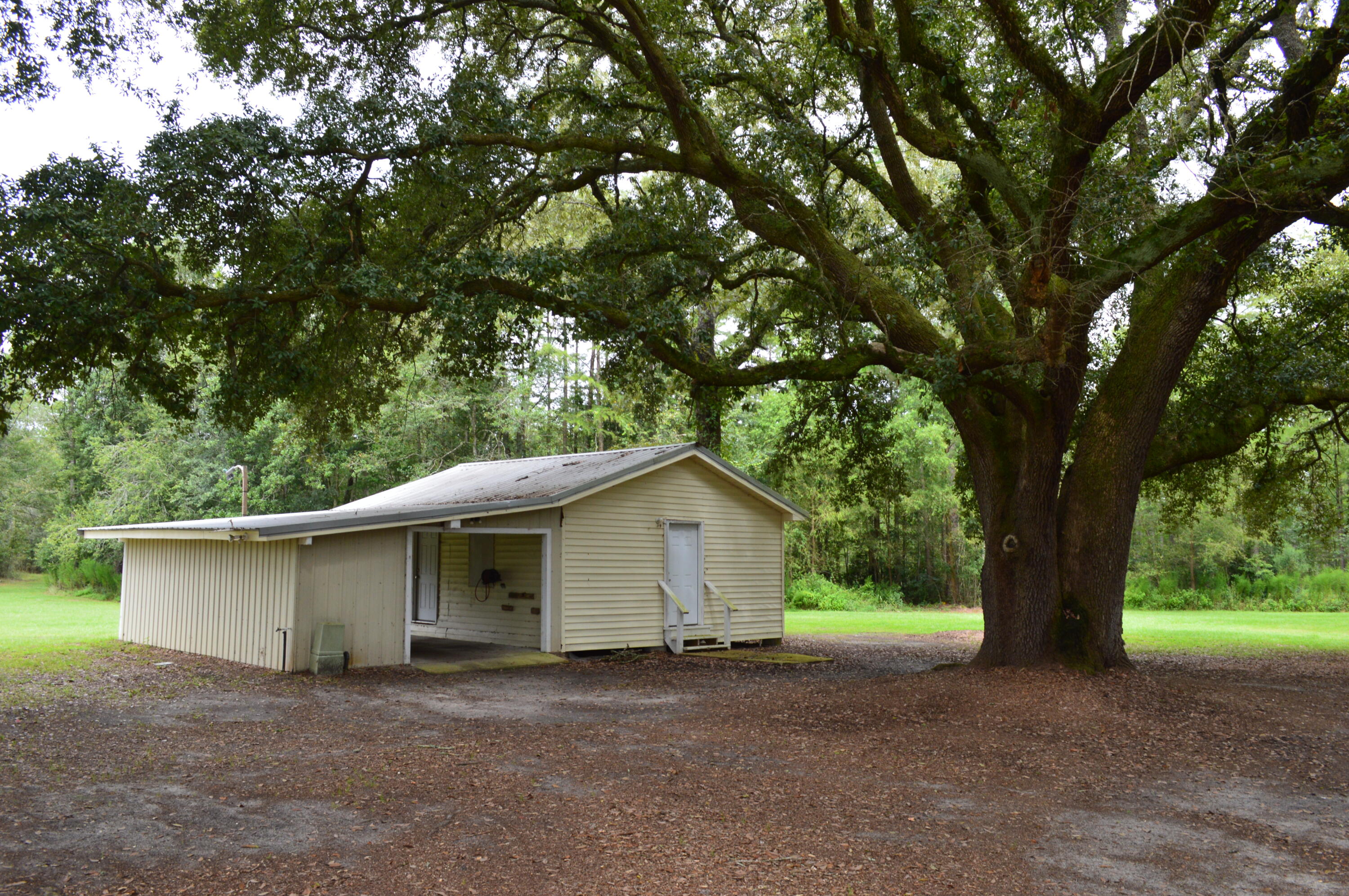 7582 Goat Hill Road See Remarks, AL 36477 - Photo 26 of 43 a house with trees in the background