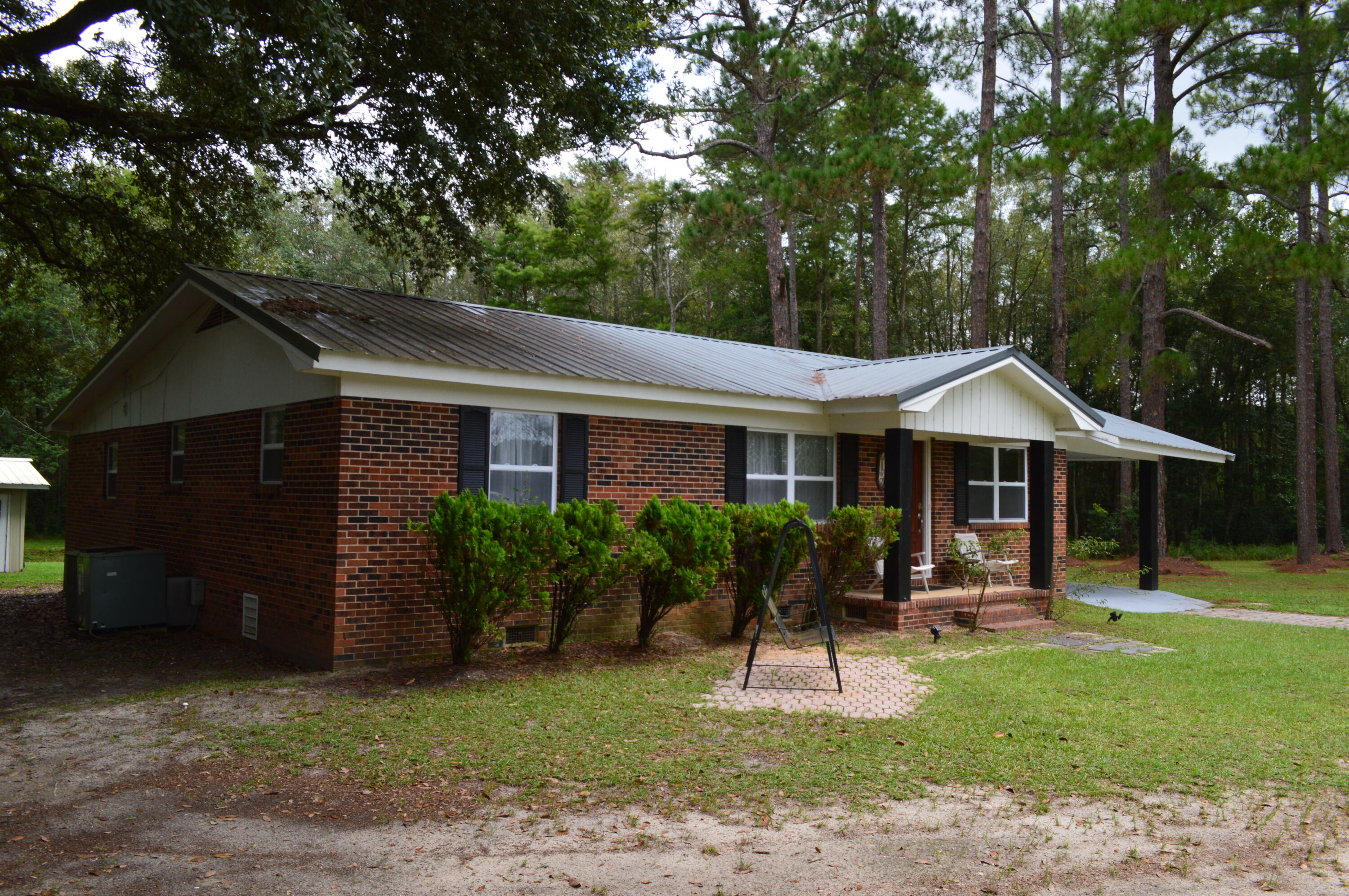 7582 Goat Hill Road See Remarks, AL 36477 - Photo 35 of 43 a front view of a house with a yard and porch