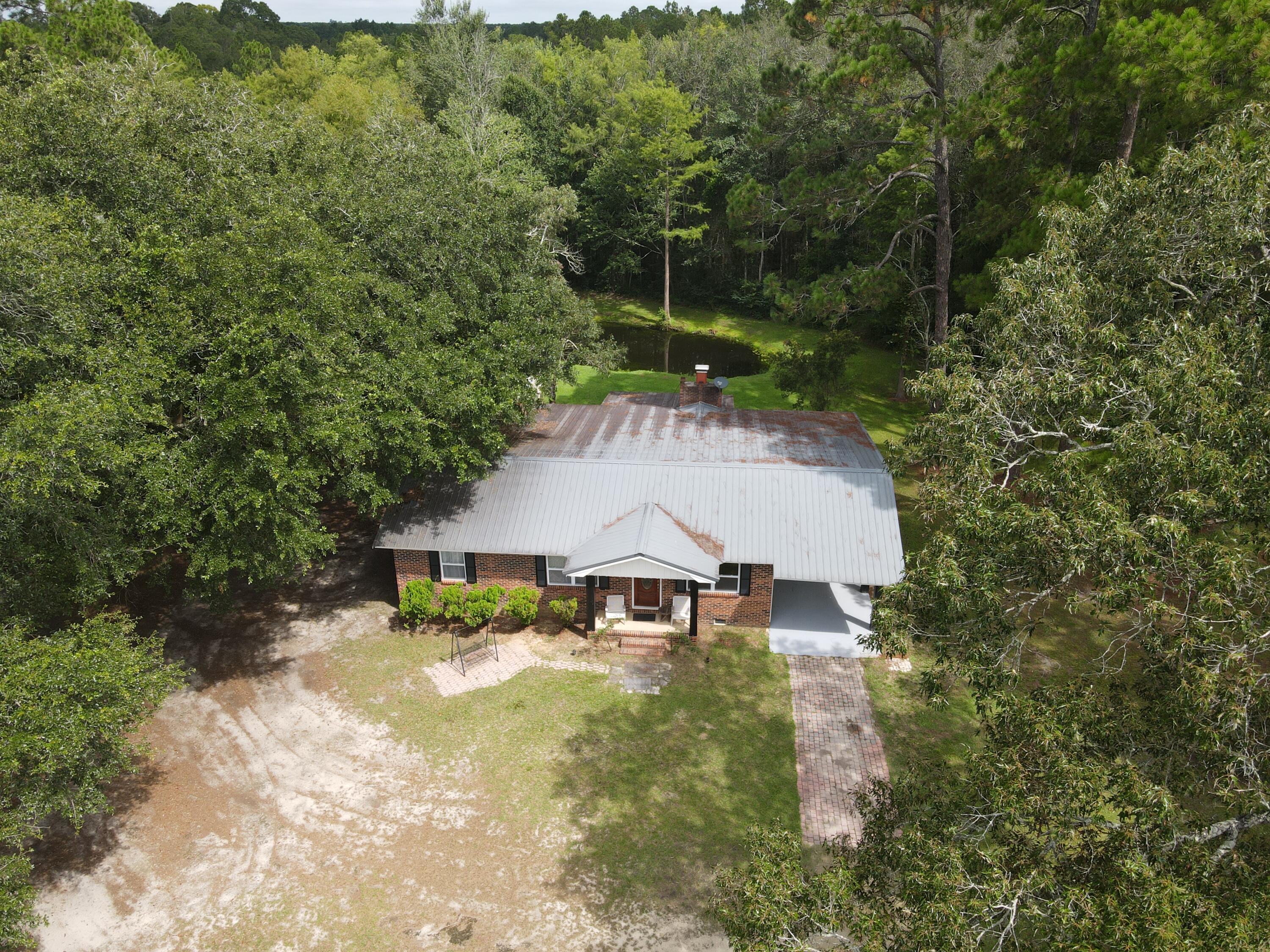 7582 Goat Hill Road See Remarks, AL 36477 - Photo 37 of 43 an aerial view of a house with swimming pool and garden