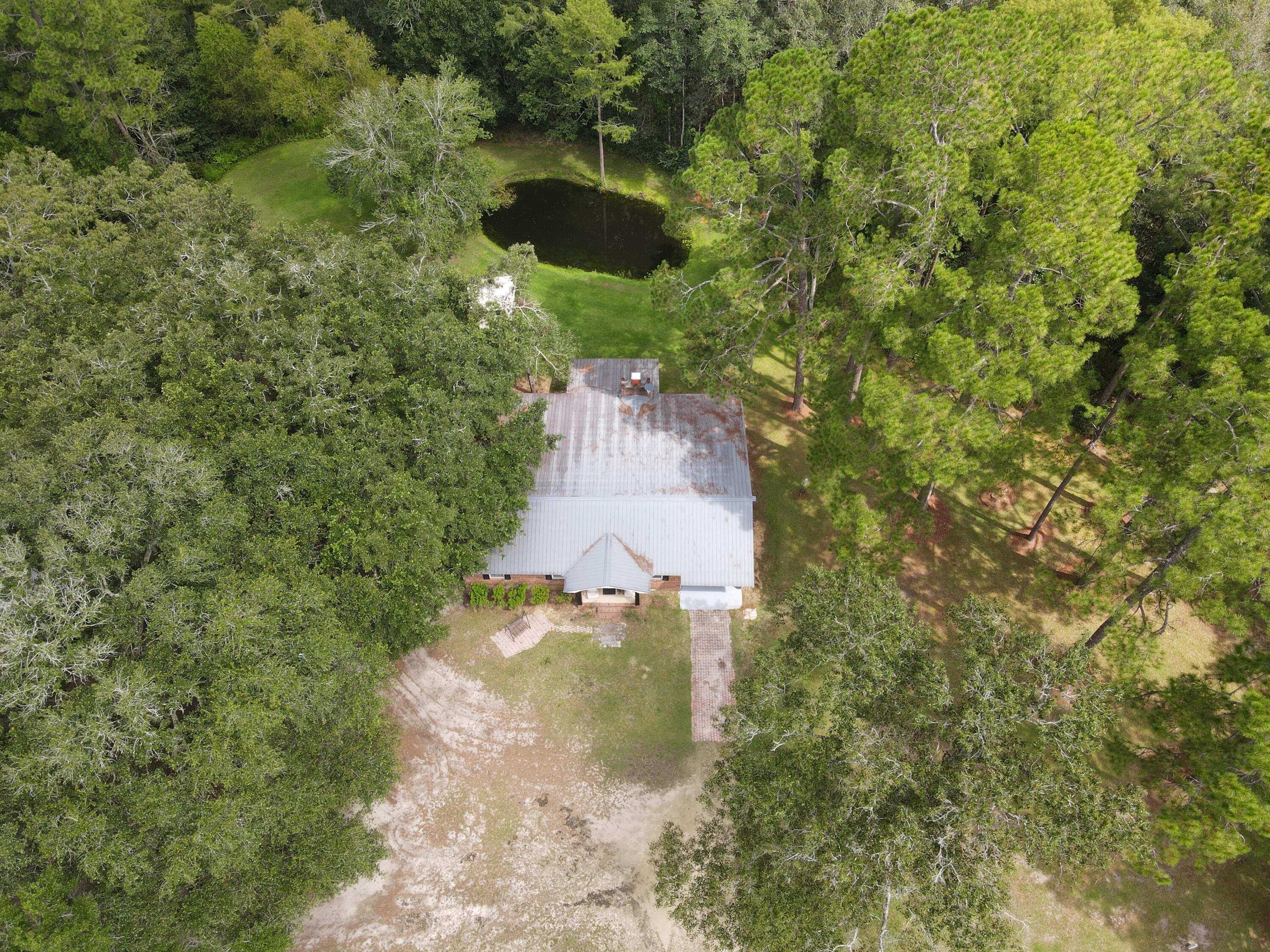 7582 Goat Hill Road See Remarks, AL 36477 - Photo 38 of 43 a aerial view of a house with a yard