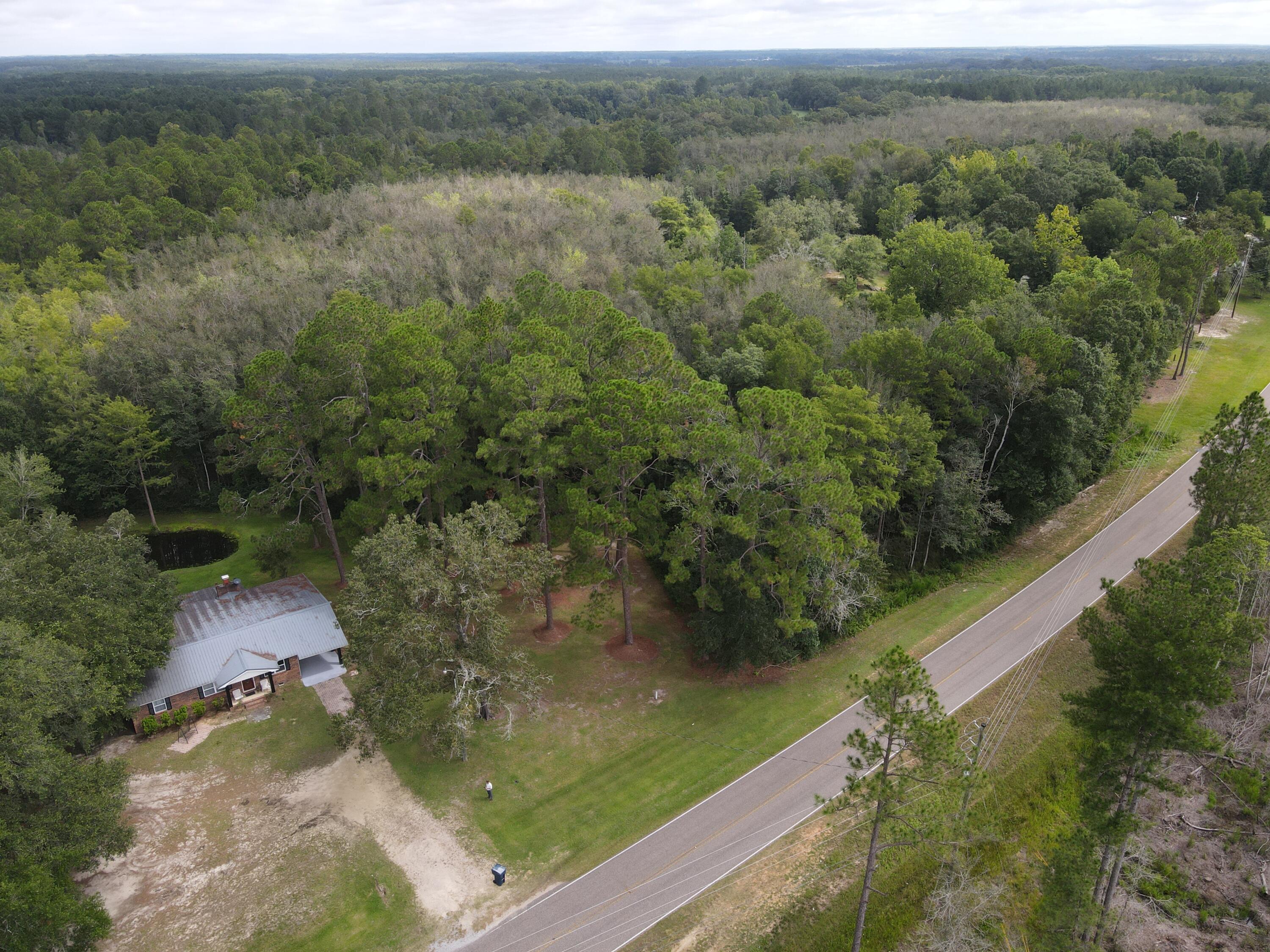 7582 Goat Hill Road See Remarks, AL 36477 - Photo 41 of 43 a view of a lake with a yard