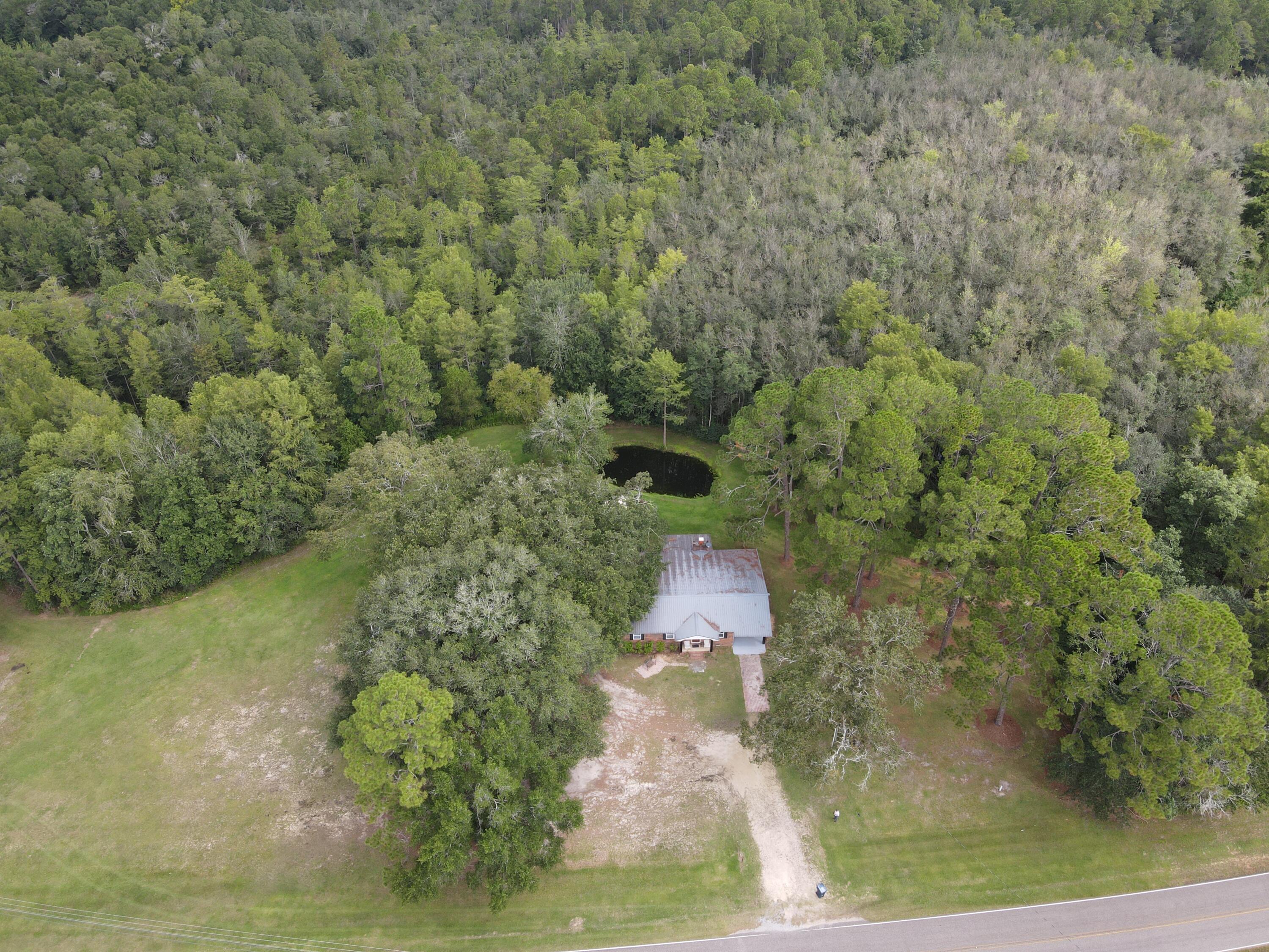 7582 Goat Hill Road See Remarks, AL 36477 - Photo 43 of 43 a bird view of a house with a yard and lake view
