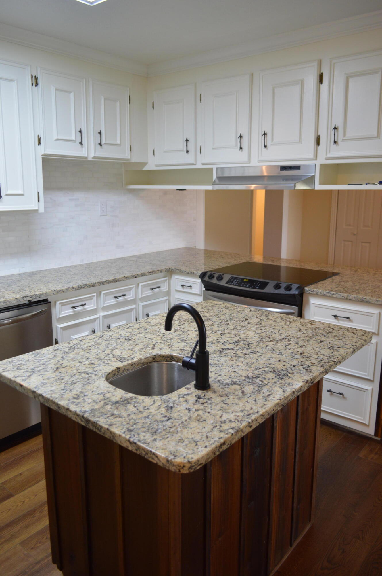 7582 Goat Hill Road See Remarks, AL 36477 - Photo 6 of 43 a kitchen with granite countertop a sink a stove and cabinets