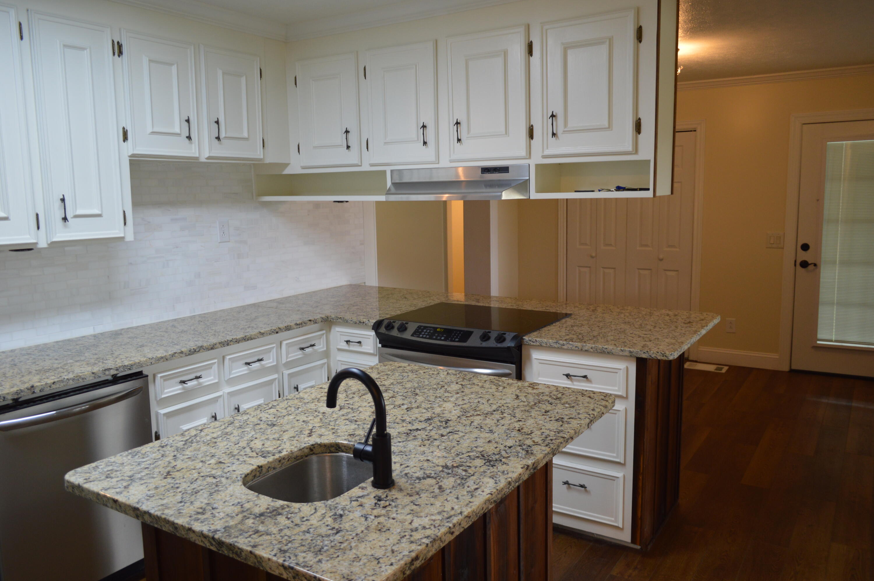 7582 Goat Hill Road See Remarks, AL 36477 - Photo 9 of 43 a kitchen with granite countertop a sink a stove and cabinets