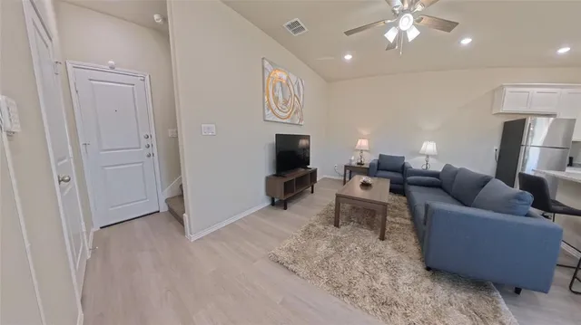 a bathroom with a toilet sink and a mirror