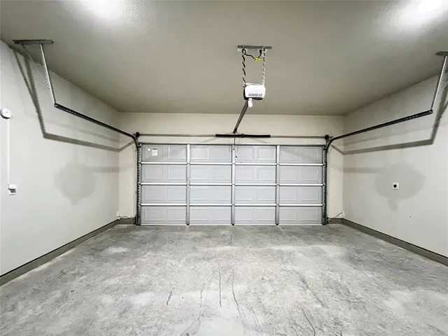 a view of a hallway with a wooden floor