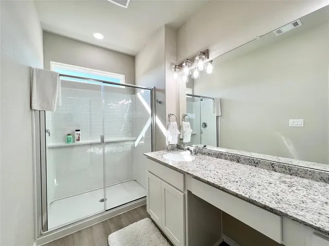 a bedroom with a large bed and a large window